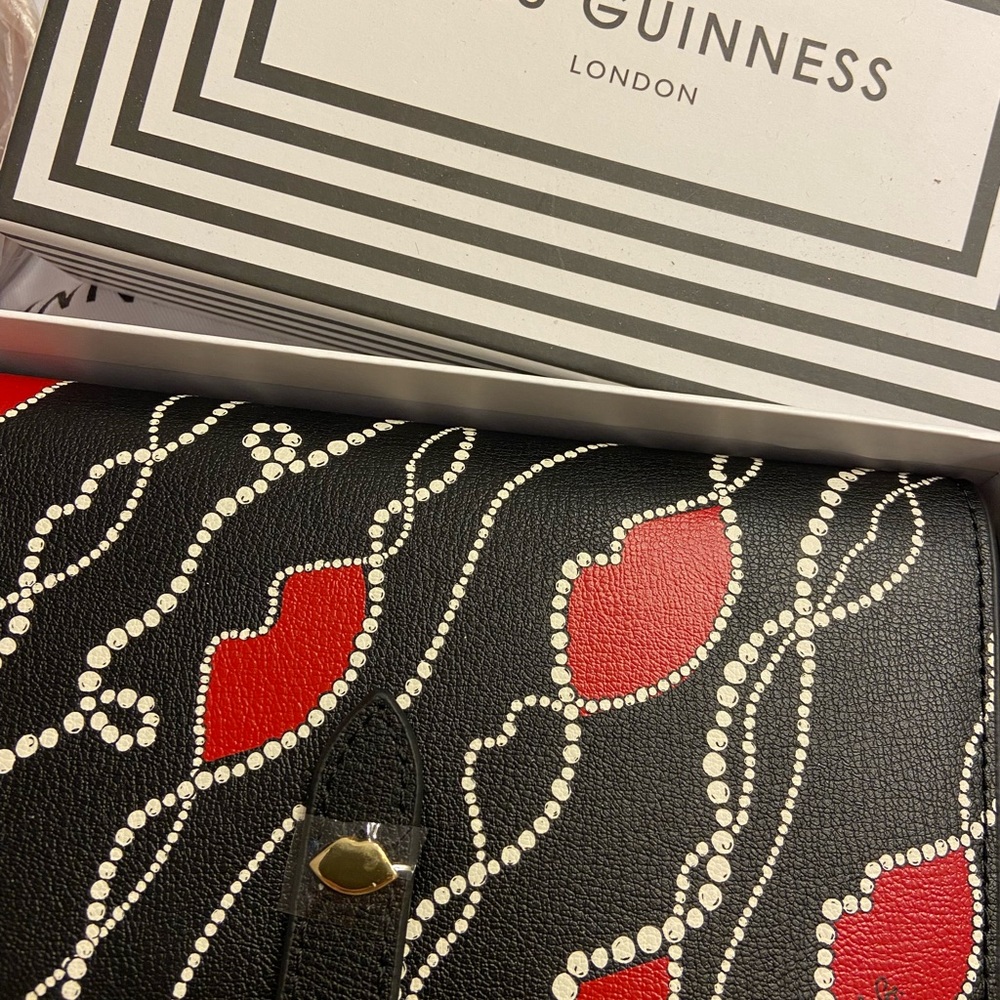 Lulu Guinness wallet with crossbody chain. Pearly lipNever used. Still has tags.